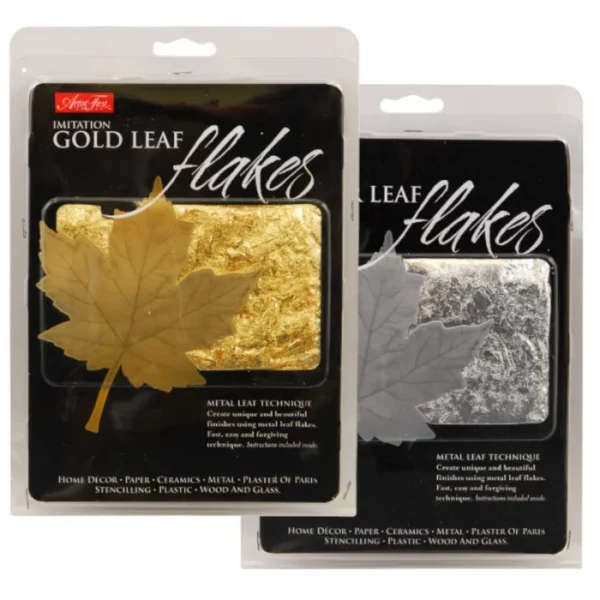 There are two packs of AFC Imitation Leaf Flakes shown overlapping each other in the center of the frame. The pack to the left contains gold flakes and the pack to the right contains silver flakes. They are in clear plastic hang tab packaging with a black printed label and a maple leaf, in the colour of the flakes inside. There is a small window in the front of the packaging, so that you can see the colour of the flakes inside. On a white background.