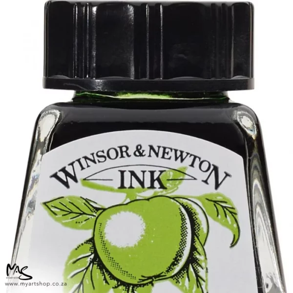 A close up of a single bottle of Apple Green Winsor & Newton Drawing Ink. The bottom of the bottle is cut off by the frame. The bottle is clear glass so you can see the colour of the ink inside, with a black screw on plastic lid. There is a label on the front of the bottle with the brand logo.