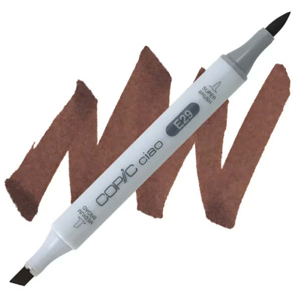 in the center of the image is a single copic marker that is sitting diagonally across the image. from left to right. it has a grey body and both caps are off showing the two different nibs, one brush at the top and the chisel tip at the bottom. it is sitting infront of a squiggle of the same colour as the marker on a white background