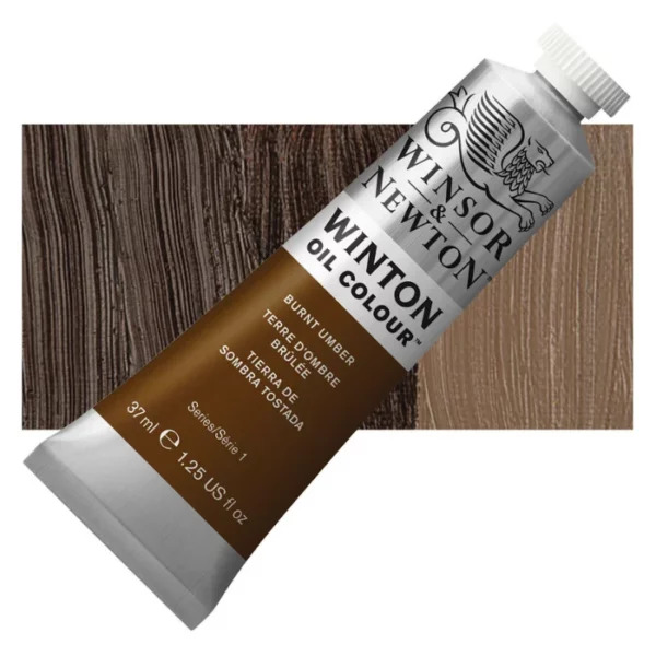 A tube of Burnt Umber Winsor and Newton Winton Oil Paint 37ml is shown diagonally, across the center of the frame. The tube is a silver colour and has a white screw on, plastic lid. The Winsor and Newton logo is printed at the top of the tube and there is a white band printed across the tube, below the logo, that has the words 'Winton Oil Colour' written on it. Below that is a colour band printed across the tube that has black text describing the product colour and paint properties. There is a rectangular colour swatch behind the tube that shows the colour of the paint. It lays horizontally across the top third of the frame. The image is center of the frame and on a white background.