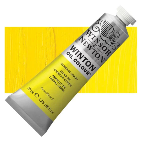 A tube of Cadmium Lemon Winsor and Newton Winton Oil Paint 37ml is shown diagonally, across the center of the frame. The tube is a silver colour and has a white screw on, plastic lid. The Winsor and Newton logo is printed at the top of the tube and there is a white band printed across the tube, below the logo, that has the words 'Winton Oil Colour' written on it. Below that is a colour band printed across the tube that has black text describing the product colour and paint properties. There is a rectangular colour swatch behind the tube that shows the colour of the paint. It lays horizontally across the top third of the frame. The image is center of the frame and on a white background.