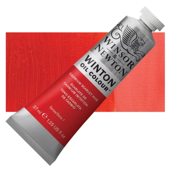 A tube of Cadmium Scarlet Hue Winsor and Newton Winton Oil Paint 37ml is shown diagonally, across the center of the frame. The tube is a silver colour and has a white screw on, plastic lid. The Winsor and Newton logo is printed at the top of the tube and there is a white band printed across the tube, below the logo, that has the words 'Winton Oil Colour' written on it. Below that is a colour band printed across the tube that has black text describing the product colour and paint properties. There is a rectangular colour swatch behind the tube that shows the colour of the paint. It lays horizontally across the top third of the frame. The image is center of the frame and on a white background.