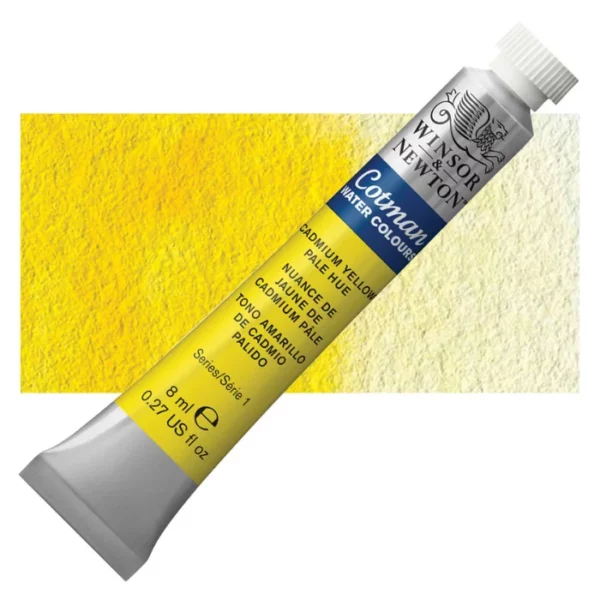 A single Cadmium Yellow Pale Hue Winsor and Newton Cotman Watercolour 8ml Tube is shown diagonally across the frame. The back of the tube is facing the bottom left hand corner of the frame and the lid of the tube is facing the top, right hand corner of the frame. The tube is silver and the Winsor and Newton logo is printed at the top of the tube. There is a blue band below the logo and the words 'Cotman Watercolour' are printed on the blue band in white. Then there is a large colour band around the base of the tube that denotes the colour of the paint. The tube colour and paint properties are indicated on this colour band in black text. The tube has a white, plastic screw on cap. There is a rectangular colour swatch behind the tube that shows how the colour works on a gradient scale. The entire image is center of the frame and on a white background.