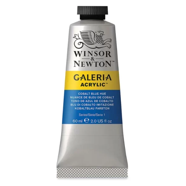 A single tube of Cobalt Blue Hue Winsor and Newton Galeria Acrylic Paint 60ml is shown in the center of the frame, standing vertically. The tube is a silver colour and has a black, screw on, plastic lid. The Winsor and Newton logo is printed at the top of the tube and there is a yellow band across the tube, under the logo, with the words, 'Galeria Acrylic'. There is a band of colour below that which denotes the colour of the paint in the tube. There is text on this colour band, describing the colour and paint properties. The image is center of the frame and on a white background.