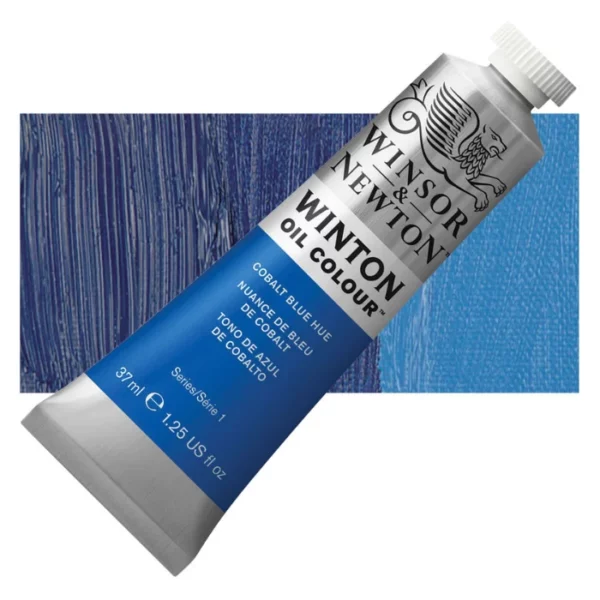 A tube of Cobalt Blue Hue Winsor and Newton Winton Oil Paint 37ml is shown diagonally, across the center of the frame. The tube is a silver colour and has a white screw on, plastic lid. The Winsor and Newton logo is printed at the top of the tube and there is a white band printed across the tube, below the logo, that has the words 'Winton Oil Colour' written on it. Below that is a colour band printed across the tube that has black text describing the product colour and paint properties. There is a rectangular colour swatch behind the tube that shows the colour of the paint. It lays horizontally across the top third of the frame. The image is center of the frame and on a white background.