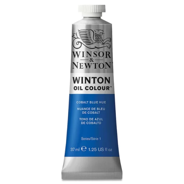 A single tube of Cobalt Blue Hue Winsor and Newton Winton Oil Paint 37ml is shown in the center of the frame, standing vertically. The tube is a silver colour and has a white screw on, plastic lid. The Winsor and Newton logo is printed at the top of the tube and there is a white band across the tube, under the logo, with the words, 'Winton Oil Colour'. There is a band of colour below that which denotes the colour of the paint in the tube. There is text on this colour band, describing the colour and paint properties. The image is center of the frame and on a white background.