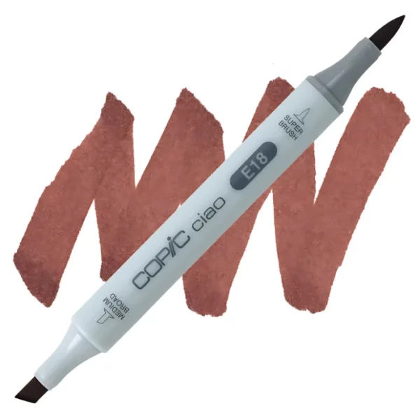 in the center of the image is a single copic marker that is sitting diagonally across the image. from left to right. it has a grey body and both caps are off showing the two different nibs, one brush at the top and the chisel tip at the bottom. it is sitting infront of a squiggle of the same colour as the marker on a white background