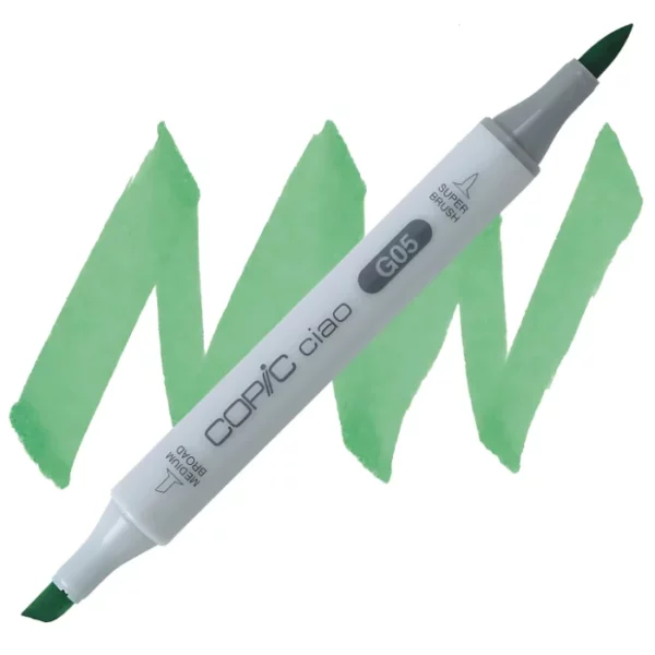 in the center of the image is a single copic marker that is sitting diagonally across the image. from left to right. it has a grey body and both caps are off showing the two different nibs, one brush at the top and the chisel tip at the bottom. it is sitting infront of a squiggle of the same colour as the marker on a white background