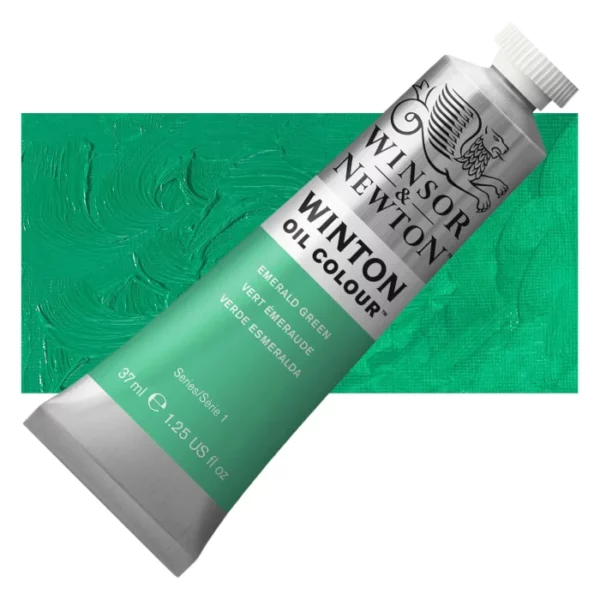 A tube of Emerald Green Winsor and Newton Winton Oil Paint 37ml is shown diagonally, across the center of the frame. The tube is a silver colour and has a white screw on, plastic lid. The Winsor and Newton logo is printed at the top of the tube and there is a white band printed across the tube, below the logo, that has the words 'Winton Oil Colour' written on it. Below that is a colour band printed across the tube that has black text describing the product colour and paint properties. There is a rectangular colour swatch behind the tube that shows the colour of the paint. It lays horizontally across the top third of the frame. The image is center of the frame and on a white background.