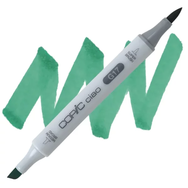 in the center of the image is a single copic marker that is sitting diagonally across the image. from left to right. it has a grey body and both caps are off showing the two different nibs, one brush at the top and the chisel tip at the bottom. it is sitting infront of a squiggle of the same colour as the marker on a white background