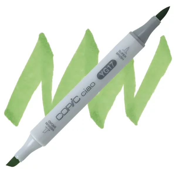 in the center of the image is a single copic marker that is sitting diagonally across the image. from left to right. it has a grey body and both caps are off showing the two different nibs, one brush at the top and the chisel tip at the bottom. it is sitting infront of a squiggle of the same colour as the marker on a white background