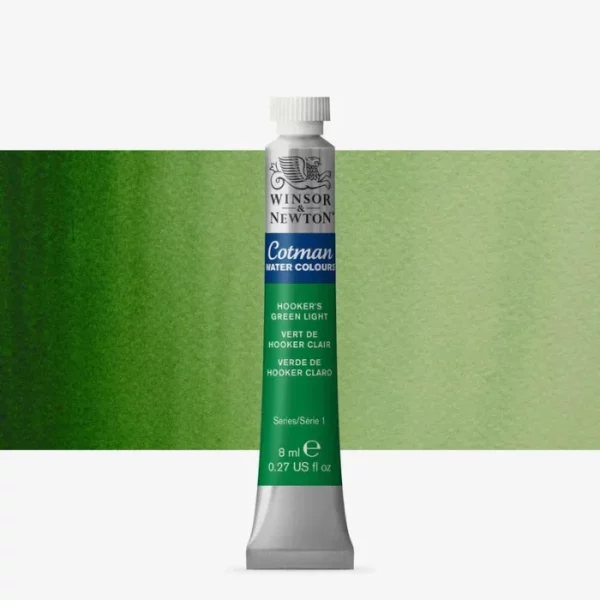 A single Hookers Green Light Winsor and Newton Cotman Watercolour 8ml Tube is shown vertically in the center of the frame. The tube is silver and the Winsor and Newton logo is printed at the top of the tube. There is a blue band below the logo and the words 'Cotman Watercolour' are printed on the blue band in white. Then there is a large colour band around the base of the tube that denotes the colour of the paint. The tube colour and paint properties are indicated on this colour band in black text. The tube has a white, plastic screw on cap. There is a rectangular colour swatch behind the tube that shows how the colour works on a gradient scale. The entire image is center of the frame and on a white background.