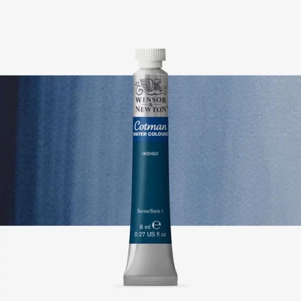 A single Indigo Winsor and Newton Cotman Watercolour 8ml Tube is shown vertically in the center of the frame. The tube is silver and the Winsor and Newton logo is printed at the top of the tube. There is a blue band below the logo and the words 'Cotman Watercolour' are printed on the blue band in white. Then there is a large colour band around the base of the tube that denotes the colour of the paint. The tube colour and paint properties are indicated on this colour band in black text. The tube has a white, plastic screw on cap. There is a rectangular colour swatch behind the tube that shows how the colour works on a gradient scale. The entire image is center of the frame and on a white background.