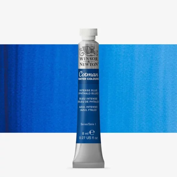 A single Intense Phthalo Blue Winsor and Newton Cotman Watercolour 8ml Tube is shown vertically in the center of the frame. The tube is silver and the Winsor and Newton logo is printed at the top of the tube. There is a blue band below the logo and the words 'Cotman Watercolour' are printed on the blue band in white. Then there is a large colour band around the base of the tube that denotes the colour of the paint. The tube colour and paint properties are indicated on this colour band in black text. The tube has a white, plastic screw on cap. There is a rectangular colour swatch behind the tube that shows how the colour works on a gradient scale. The entire image is center of the frame and on a white background.