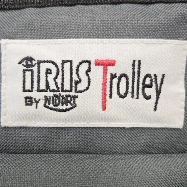 A close up of teh sewn on fabric logo of the Iris Art Material Storage Trolley.