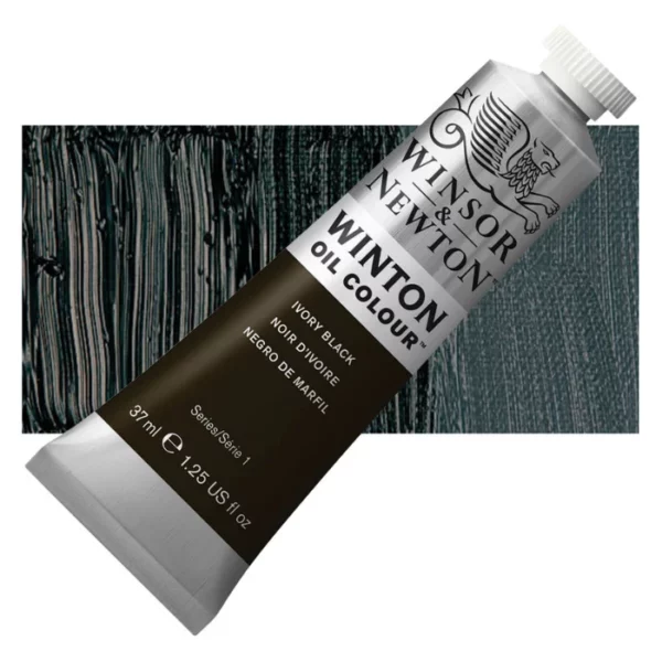 A tube of Ivory Black Winsor and Newton Winton Oil Paint 37ml is shown diagonally, across the center of the frame. The tube is a silver colour and has a white screw on, plastic lid. The Winsor and Newton logo is printed at the top of the tube and there is a white band printed across the tube, below the logo, that has the words 'Winton Oil Colour' written on it. Below that is a colour band printed across the tube that has black text describing the product colour and paint properties. There is a rectangular colour swatch behind the tube that shows the colour of the paint. It lays horizontally across the top third of the frame. The image is center of the frame and on a white background.