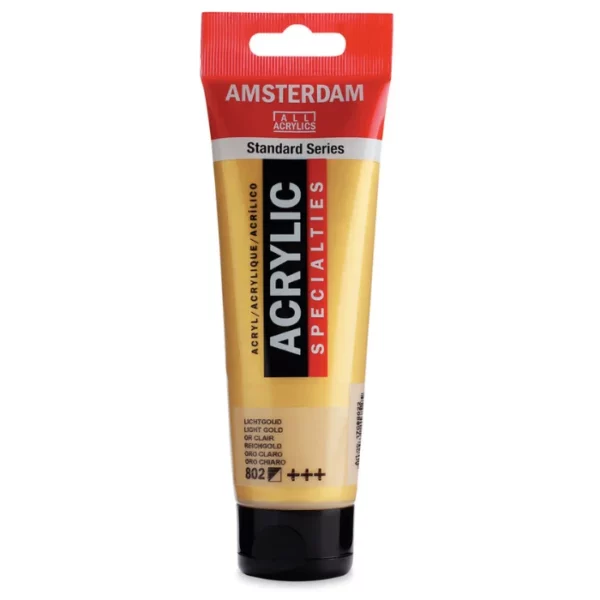 A single tube of Light Gold Amsterdam Acrylic Paint 120ml is standing vertically in the center of the frame. The tube is made of a clear plastic and has a red band at the end of the tube with a hole so it can hang. The tube has a black, plastic flip top cap, that the bottle stands on. There is black text on the body of the tube describing the product colour and details. The colour of the paint can be seen through the tube. On a white background.