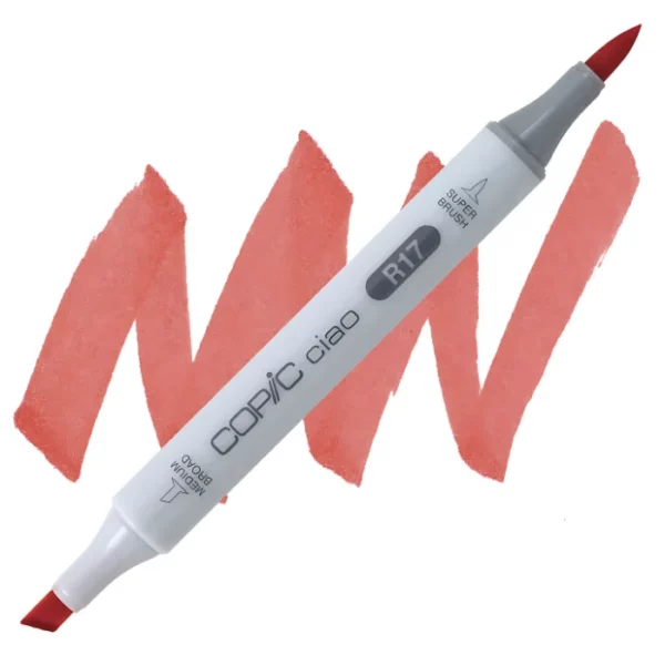 in the center of the image is a single copic marker that is sitting diagonally across the image. from left to right. it has a grey body and both caps are off showing the two different nibs, one brush at the top and the chisel tip at the bottom. it is sitting infront of a squiggle of the same colour as the marker on a white background