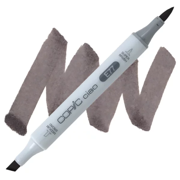 in the center of the image is a single copic marker that is sitting diagonally across the image. from left to right. it has a grey body and both caps are off showing the two different nibs, one brush at the top and the chisel tip at the bottom. it is sitting infront of a squiggle of the same colour as the marker on a white background