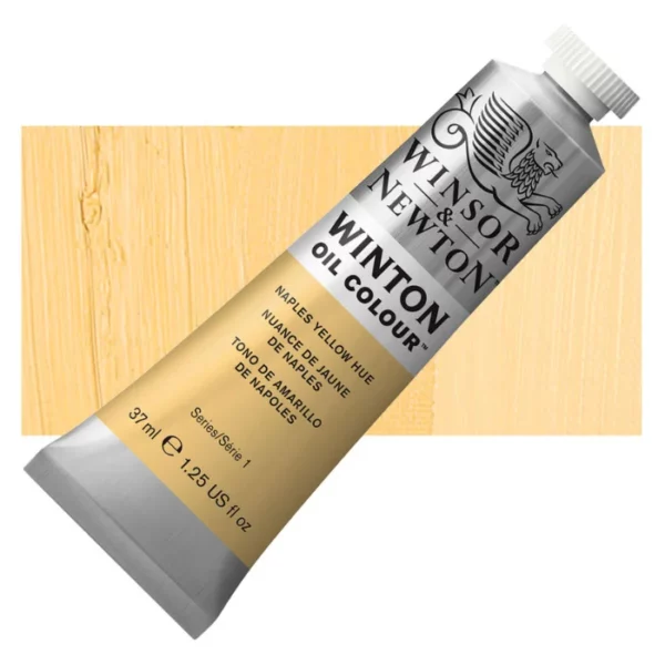 A tube of Naples Yellow Hue Winsor and Newton Winton Oil Paint 37ml is shown diagonally, across the center of the frame. The tube is a silver colour and has a white screw on, plastic lid. The Winsor and Newton logo is printed at the top of the tube and there is a white band printed across the tube, below the logo, that has the words 'Winton Oil Colour' written on it. Below that is a colour band printed across the tube that has black text describing the product colour and paint properties. There is a rectangular colour swatch behind the tube that shows the colour of the paint. It lays horizontally across the top third of the frame. The image is center of the frame and on a white background.