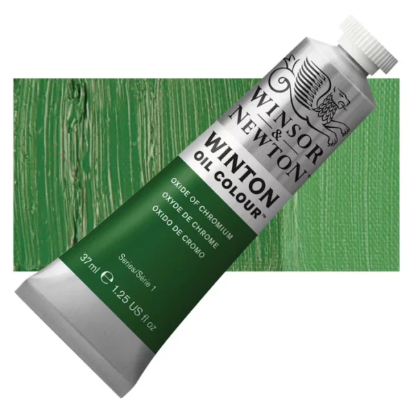 A tube of Oxide Of Chromium Winsor and Newton Winton Oil Paint 37ml is shown diagonally, across the center of the frame. The tube is a silver colour and has a white screw on, plastic lid. The Winsor and Newton logo is printed at the top of the tube and there is a white band printed across the tube, below the logo, that has the words 'Winton Oil Colour' written on it. Below that is a colour band printed across the tube that has black text describing the product colour and paint properties. There is a rectangular colour swatch behind the tube that shows the colour of the paint. It lays horizontally across the top third of the frame. The image is center of the frame and on a white background.