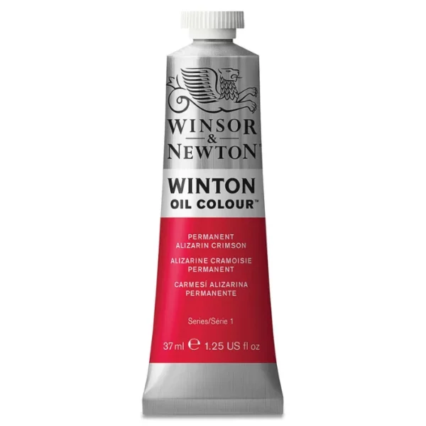 A single tube of Permanent Alizarin Crimson Winsor and Newton Winton Oil Paint 37ml is shown in the center of the frame, standing vertically. The tube is a silver colour and has a white screw on, plastic lid. The Winsor and Newton logo is printed at the top of the tube and there is a white band across the tube, under the logo, with the words, 'Winton Oil Colour'. There is a band of colour below that which denotes the colour of the paint in the tube. There is text on this colour band, describing the colour and paint properties. The image is center of the frame and on a white background.