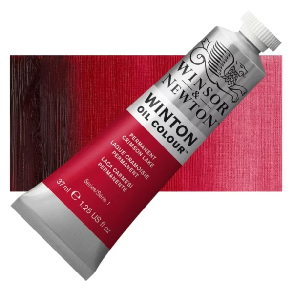 A tube of Permanent Crimson Lake Winsor and Newton Winton Oil Paint 37ml is shown diagonally, across the center of the frame. The tube is a silver colour and has a white screw on, plastic lid. The Winsor and Newton logo is printed at the top of the tube and there is a white band printed across the tube, below the logo, that has the words 'Winton Oil Colour' written on it. Below that is a colour band printed across the tube that has black text describing the product colour and paint properties. There is a rectangular colour swatch behind the tube that shows the colour of the paint. It lays horizontally across the top third of the frame. The image is center of the frame and on a white background.