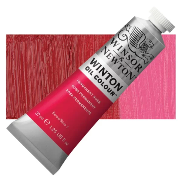 A tube of Permanent Rose Winsor and Newton Winton Oil Paint 37ml is shown diagonally, across the center of the frame. The tube is a silver colour and has a white screw on, plastic lid. The Winsor and Newton logo is printed at the top of the tube and there is a white band printed across the tube, below the logo, that has the words 'Winton Oil Colour' written on it. Below that is a colour band printed across the tube that has black text describing the product colour and paint properties. There is a rectangular colour swatch behind the tube that shows the colour of the paint. It lays horizontally across the top third of the frame. The image is center of the frame and on a white background.