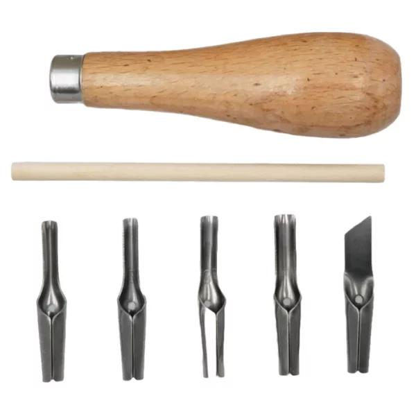 The contents of a Prime Art Lino Cutting Tool Set is shown loose in the frame. Each item is stacked one below the other. At the top of the frame is a wooden handle. Below the handle is a wooden stick that is round in shape and used to remove the blades. There are 5 metal blades lined up along the bottom of the frame. The each have a different shape. On a white background.