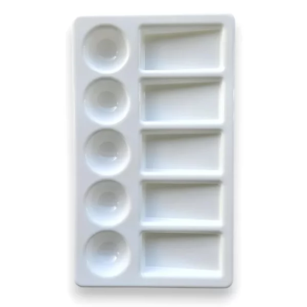 A Prime Art Plastic Palette 10 Well Rectangular is shown, vertically in the center of the frame. The palette is made of a white plastic and has 10 wells to hold colour. 5 of the wells are small and circular in shape, and the other 5 are rectangular. The image is center of the frame and on a white background.