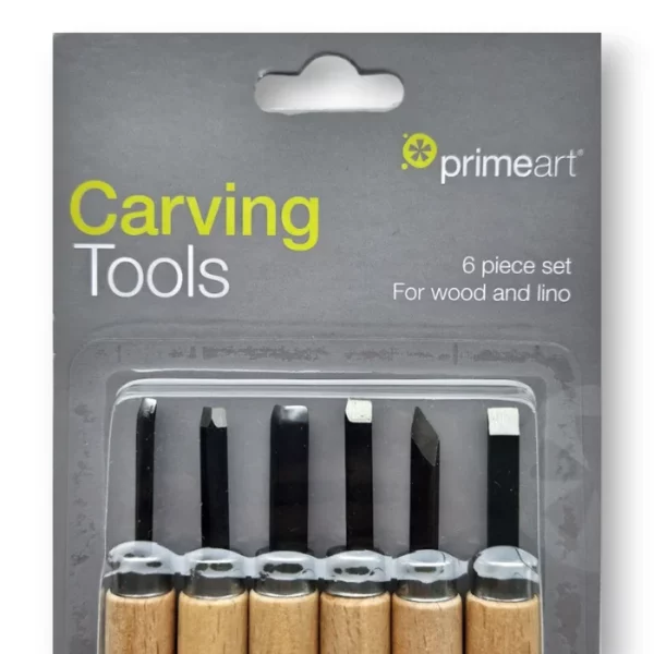 A close up of a single Prime Art Wood Carving Set is shown, vertically, in the center of the frame. The set contains a printed grey cardboard backing board and a clear, thick plastic top that is moulded to the shape of the tools. You can see the tools inside the the set through the clear plastic cover. The tools have a wooden handle and a metal blade. Each tool's blade has a different shape. On a white background.