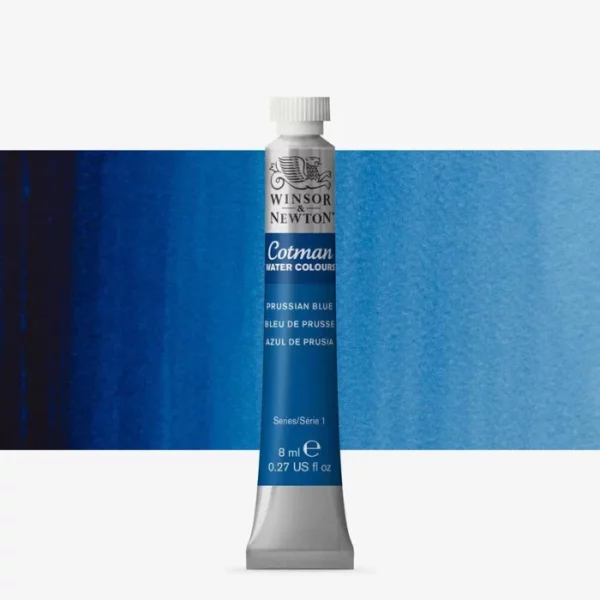 A single Prussian Blue Winsor and Newton Cotman Watercolour 8ml Tube is shown vertically in the center of the frame. The tube is silver and the Winsor and Newton logo is printed at the top of the tube. There is a blue band below the logo and the words 'Cotman Watercolour' are printed on the blue band in white. Then there is a large colour band around the base of the tube that denotes the colour of the paint. The tube colour and paint properties are indicated on this colour band in black text. The tube has a white, plastic screw on cap. There is a rectangular colour swatch behind the tube that shows how the colour works on a gradient scale. The entire image is center of the frame and on a white background.