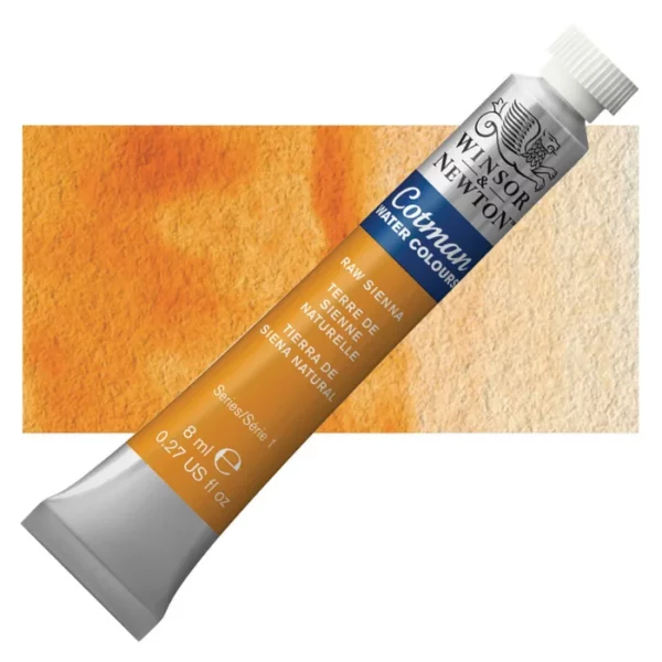 A single Raw Sienna Winsor and Newton Cotman Watercolour 8ml Tube is shown diagonally across the frame. The back of the tube is facing the bottom left hand corner of the frame and the lid of the tube is facing the top, right hand corner of the frame. The tube is silver and the Winsor and Newton logo is printed at the top of the tube. There is a blue band below the logo and the words 'Cotman Watercolour' are printed on the blue band in white. Then there is a large colour band around the base of the tube that denotes the colour of the paint. The tube colour and paint properties are indicated on this colour band in black text. The tube has a white, plastic screw on cap. There is a rectangular colour swatch behind the tube that shows how the colour works on a gradient scale. The entire image is center of the frame and on a white background.