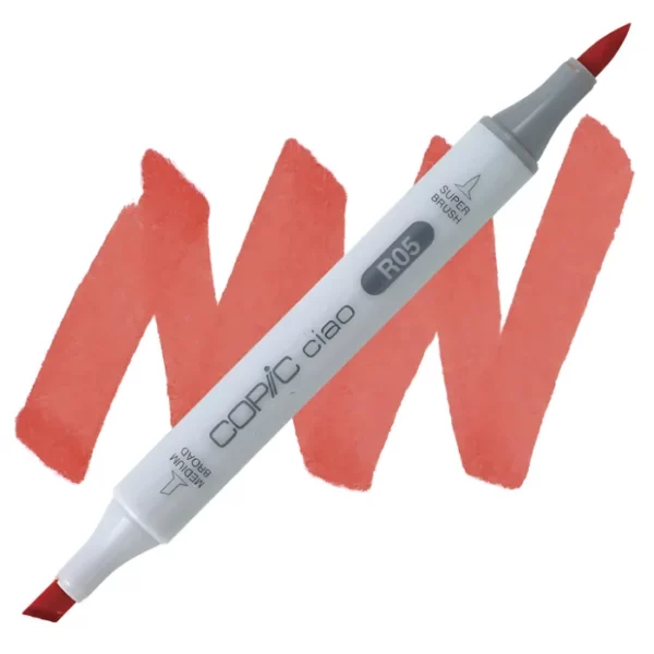 in the center of the image is a single copic marker that is sitting diagonally across the image. from left to right. it has a grey body and both caps are off showing the two different nibs, one brush at the top and the chisel tip at the bottom. it is sitting infront of a squiggle of the same colour as the marker on a white background