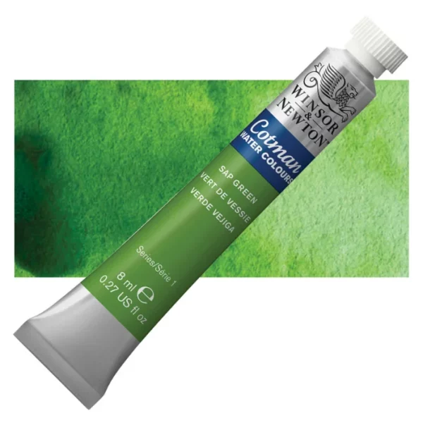 A single Sap Green Winsor and Newton Cotman Watercolour 8ml Tube is shown diagonally across the frame. The back of the tube is facing the bottom left hand corner of the frame and the lid of the tube is facing the top, right hand corner of the frame. The tube is silver and the Winsor and Newton logo is printed at the top of the tube. There is a blue band below the logo and the words 'Cotman Watercolour' are printed on the blue band in white. Then there is a large colour band around the base of the tube that denotes the colour of the paint. The tube colour and paint properties are indicated on this colour band in black text. The tube has a white, plastic screw on cap. There is a rectangular colour swatch behind the tube that shows how the colour works on a gradient scale. The entire image is center of the frame and on a white background.