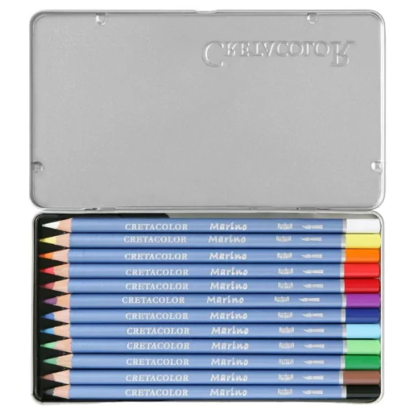 An open Set of 12 Cretacolor Marino Aquarelle Pencils is shown in the center of the frame horizontally. The hinged lid is open and you can see the pencils lined up next to each other in the base of the tin. The pencils have a blue barrel with the Cretacolor logo printed on them. The end of each pencil is dipped in a colour to denote the colour of the lead. On a white background.