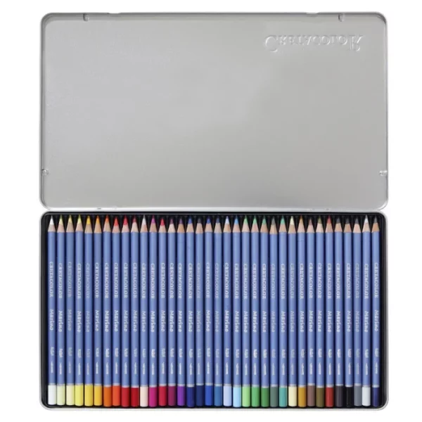 An open Set of 36 Cretacolor Marino Aquarelle Pencils is shown in the center of the frame horizontally. The hinged lid is open and you can see the pencils lined up next to each other in the base of the tin. The pencils have a blue barrel with the Cretacolor logo printed on them. The end of each pencil is dipped in a colour to denote the colour of the lead. On a white background.