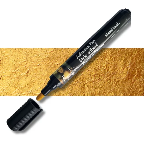 A single Speedball Adhesive Leaf Pen is shown diagonally across the frame. The cap is off and placed just in front of the pen, so you can see the gold felt nib. It is a black pen with a picture of the Mona Lisa on it and white text. There is a gold leaf horizontal strip across the center of the frame, behind the pen. On a white background.