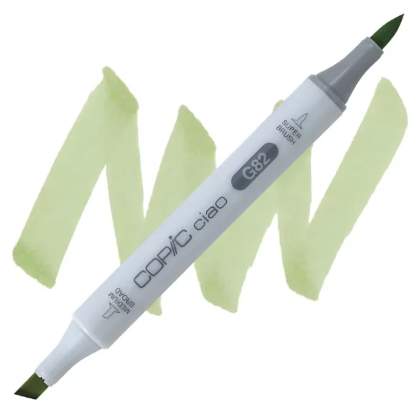 in the center of the image is a single copic marker that is sitting diagonally across the image. from left to right. it has a grey body and both caps are off showing the two different nibs, one brush at the top and the chisel tip at the bottom. it is sitting infront of a squiggle of the same colour as the marker on a white background