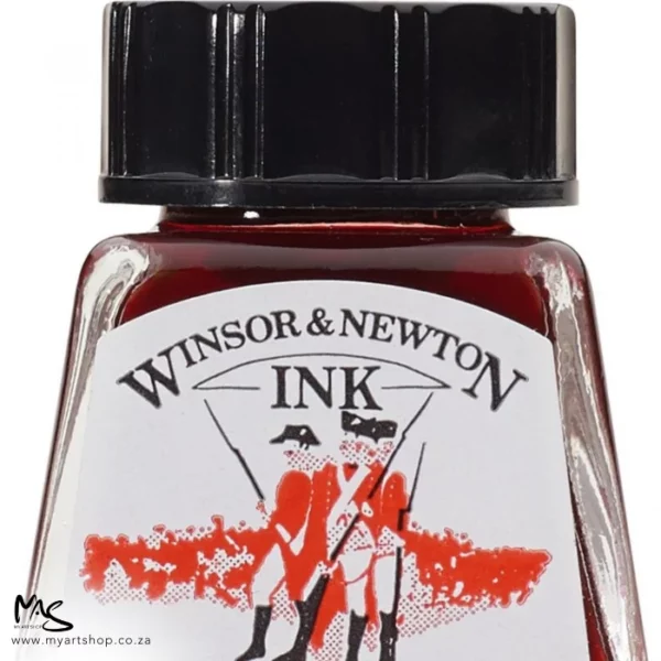 A close up of a single bottle of Vermillion Winsor & Newton Drawing Ink. The bottom of the bottle is cut off by the frame. The bottle is clear glass so you can see the colour of the ink inside, with a black screw on plastic lid. There is a label on the front of the bottle with the brand logo.