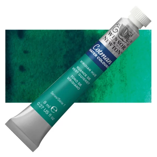 A single Viridian Hue Winsor and Newton Cotman Watercolour 8ml Tube is shown diagonally across the frame. The back of the tube is facing the bottom left hand corner of the frame and the lid of the tube is facing the top, right hand corner of the frame. The tube is silver and the Winsor and Newton logo is printed at the top of the tube. There is a blue band below the logo and the words 'Cotman Watercolour' are printed on the blue band in white. Then there is a large colour band around the base of the tube that denotes the colour of the paint. The tube colour and paint properties are indicated on this colour band in black text. The tube has a white, plastic screw on cap. There is a rectangular colour swatch behind the tube that shows how the colour works on a gradient scale. The entire image is center of the frame and on a white background.