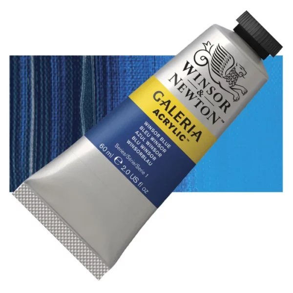 A tube of Winsor Blue Winsor and Newton Galeria Acrylic Paint 60ml is shown diagonally, across the center of the frame. The tube is a silver colour and has a black, screw on, plastic lid. The Winsor and Newton logo is printed at the top of the tube and there is a yellow band across the tube, under the logo, with the words, 'Galeria Acrylic'. There is a band of colour below that which denotes the colour of the paint in the tube. There is text on this colour band, describing the colour and paint properties. There is a rectangular colour swatch behind the tube that shows the colour of the paint. It lays horizontally across the top third of the frame. The image is center of the frame and on a white background.