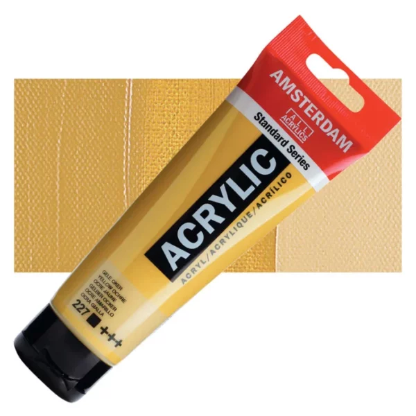 A single tube of Yellow Ochre Amsterdam Acrylic Paint 120ml is shown diagonally across the center of the frame. The tube is made of a clear plastic and has a red band at the end of the tube with a hole so it can hang. The tube has a black, plastic flip top cap, that the bottle stands on. There is black text on the body of the tube describing the product colour and details. The colour of the paint can be seen through the tube. There is a rectangular colour swatch of the paint, behind the tube. The swatch shows the colour in different gradient's. The image is center of the frame and on a white background.