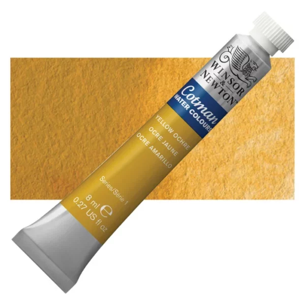 A single Yellow Ochre Winsor and Newton Cotman Watercolour 8ml Tube is shown diagonally across the frame. The back of the tube is facing the bottom left hand corner of the frame and the lid of the tube is facing the top, right hand corner of the frame. The tube is silver and the Winsor and Newton logo is printed at the top of the tube. There is a blue band below the logo and the words 'Cotman Watercolour' are printed on the blue band in white. Then there is a large colour band around the base of the tube that denotes the colour of the paint. The tube colour and paint properties are indicated on this colour band in black text. The tube has a white, plastic screw on cap. There is a rectangular colour swatch behind the tube that shows how the colour works on a gradient scale. The entire image is center of the frame and on a white background.