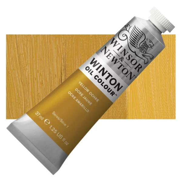 A tube of Yellow Ochre Winsor and Newton Winton Oil Paint 37ml is shown diagonally, across the center of the frame. The tube is a silver colour and has a white screw on, plastic lid. The Winsor and Newton logo is printed at the top of the tube and there is a white band printed across the tube, below the logo, that has the words 'Winton Oil Colour' written on it. Below that is a colour band printed across the tube that has black text describing the product colour and paint properties. There is a rectangular colour swatch behind the tube that shows the colour of the paint. It lays horizontally across the top third of the frame. The image is center of the frame and on a white background.