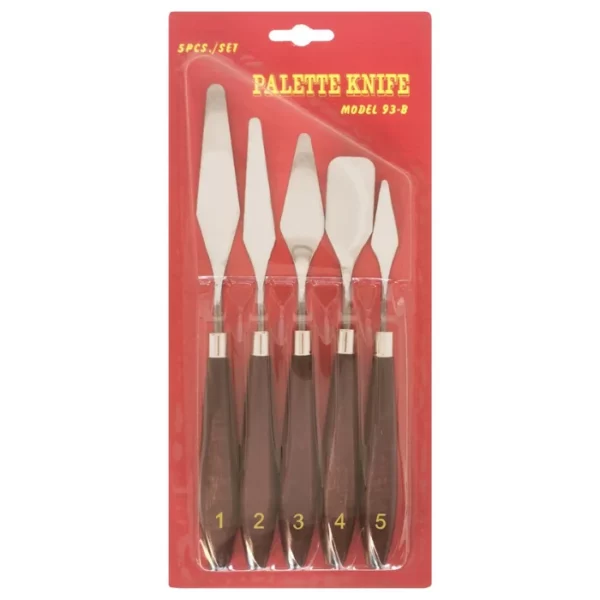 A single Pro Art Steel Palette Knife Set is shown vertically in the center of the frame. The set has a red cardboard backing board and a clear, molded plastic cover. You can see the knives through the packaging. They have wooden handles and metal blades. Each knife has a different shaped blade. There are 5 palette knives in the set.