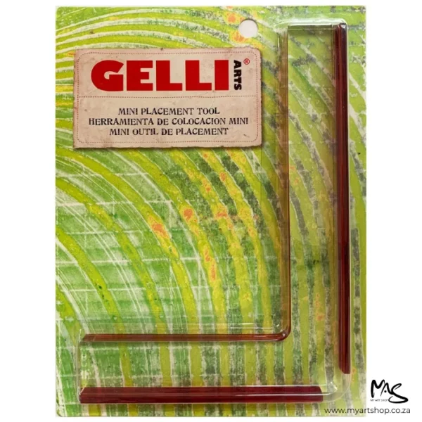 A single Gelli Arts Mini Placement Guide in it's packaging is shown from a front view in the center of the frame. The packaging is a green printed piece of cardbord, with the gelli plate guide on top and covered in a clear plastic packet. The image is center of the frame and on a white background.