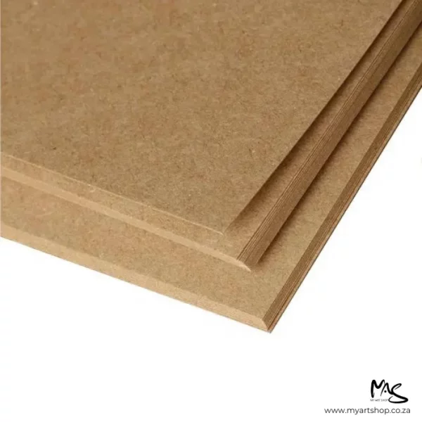 There is a close up of a pile of papers from a Prime Art Kraft Pad, shown in the top of the frame. The kraft coloured papers are coming out of the top of the frame and are cut off by the frame. They are on a white background.