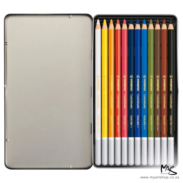 A single Stabilo CarbOthello Chalk Pastel Pencil Set of 12 can be seen open, in the center of the frame. The hinged metal lid is facing the left hand side of the frame and the pencils can be seen, lined up next to each other, in the bottom of the tin. The pencils have different coloured barrels and the lead matches the colour of the barrel for easy identification. The ends of the pencils are dipped in a grey colour. The image is center of the frame and on a white background.
