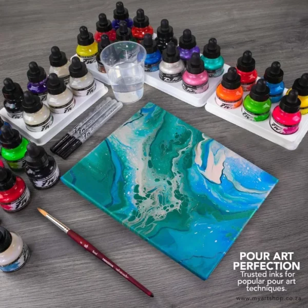 A promotional image for Daler Rowney FW Acrylic Inks. A birds eye view of a number of inks on a surface with a canvas that has a poured ink pattern on it in blues and greens and whites.There are some paint brushes and markers around the inks. There are 20 different coloured ink bottles in the frame.